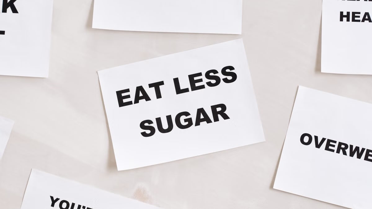Minimalist photograph of motivational cards with healthy lifestyle messages on a white background.